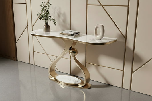 Modern console table with marble top and gold base against a neutral wall.