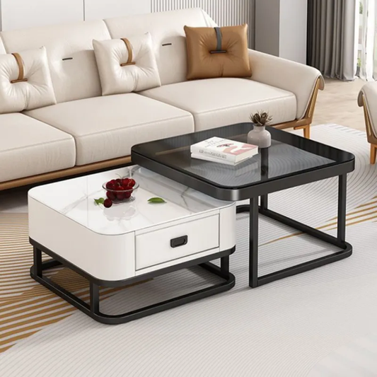 Two coffee tables, one white and one black, in a living room setting with a beige sofa.