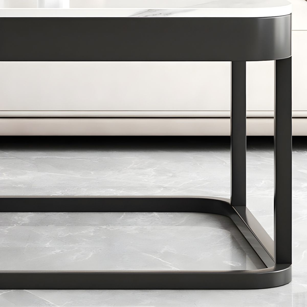 Close-up of a modern coffee table with marble-like surface and black metal frame.