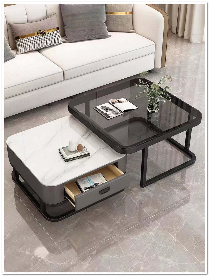 Modern coffee table with glass top and storage compartments in a living room setting.