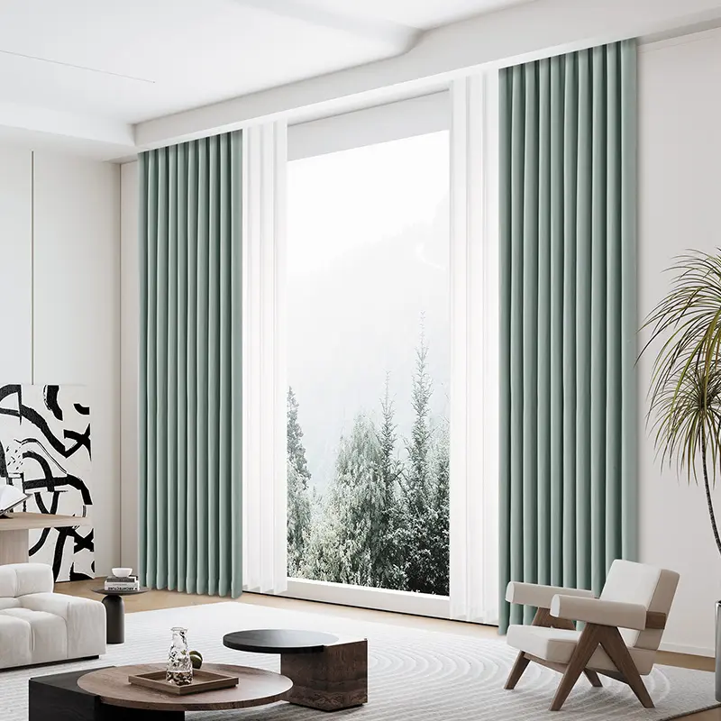 Modern living room with large windows and light green curtains