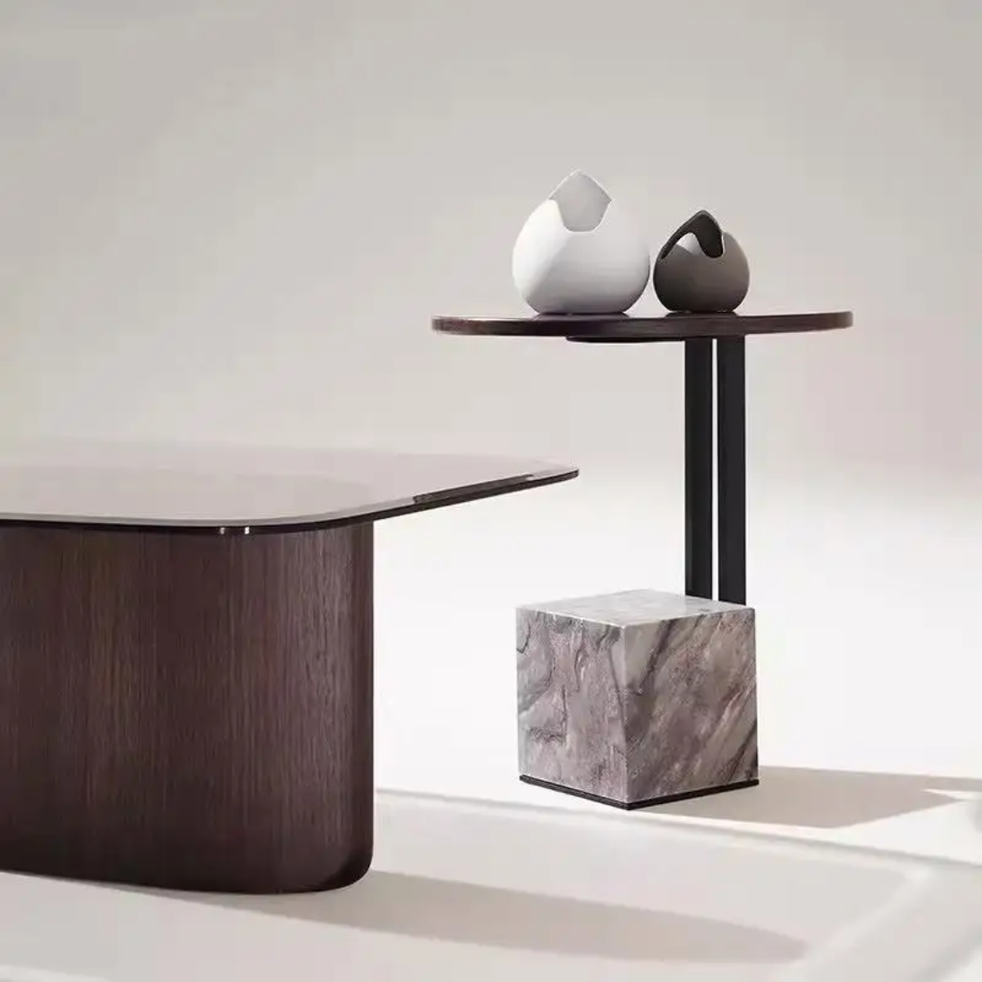 Modern furniture piece with a dark wooden table and marble cube on a light background