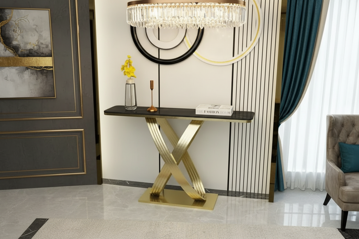 Console table with gold base and black top in a modern interior setting