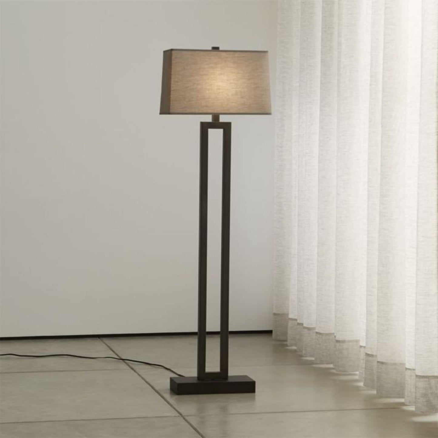 Modern standing floor lamp with a sleek design and a neutral fabric shade for stylish home decor