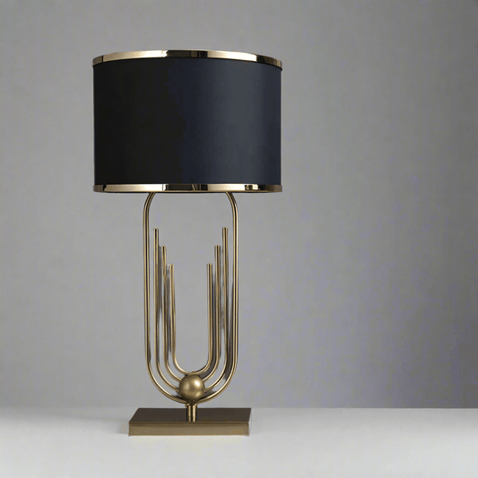 Elegant N I CREATIONS table lamp with a gold base and black shade, perfect for modern home decor
