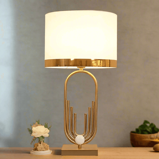 Elegant N I CREATIONS table lamp desk with a golden base and white shade, perfect for home decor