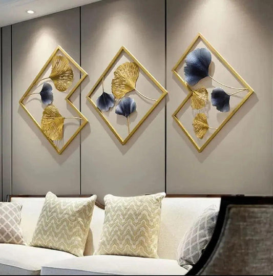 Multicolor metal ginkgo leaf wall art mounted above sofa – handcrafted nature decor for living room