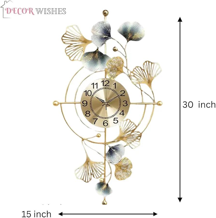 Elegant N I CREATIONS wall clock featuring leafy design in gold with a modern aesthetic