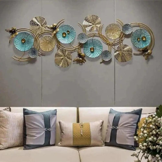 Abstract metal wall sculpture featuring human figures – hung on a modern living room wall